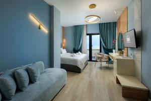 En eller flere senge i et værelse på Hotel Brilant Saranda