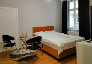 Posteľ alebo postele v izbe v ubytovaní Hugo Star Apartments