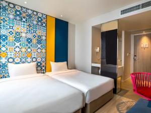Postel nebo postele na pokoji v ubytování Ibis Styles Phuket City