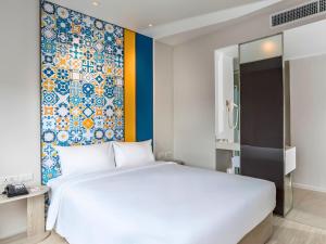Postel nebo postele na pokoji v ubytování Ibis Styles Phuket City