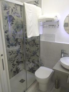 a bathroom with a shower with a toilet and a sink at Casa vacanze Venere in Balestrate +33 photos