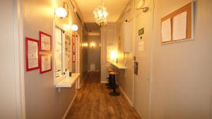 a hallway with a long hallway with a room with a hallway at Paraiso Hostel in Barcelona