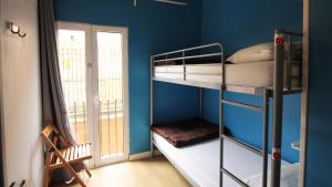 Posteľ alebo postele v izbe v ubytovaní Paraiso Hostel