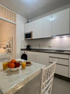 Kuchyňa alebo kuchynka v ubytovaní Home Boutique Cervantes