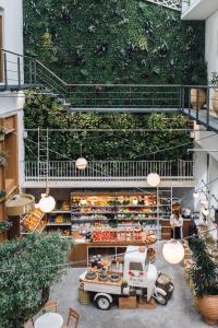 a shop with a green wall in a building at Ergon House in Athens