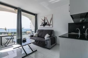 A seating area at Seafront Playa del Cura apartment