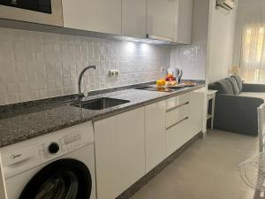 Kuchyňa alebo kuchynka v ubytovaní Home Boutique Cervantes