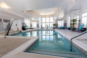 a large swimming pool in a large building at Residence Inn by Marriott Cleveland Avon at The Emerald Event Center in Avon