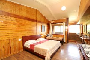 Postel nebo postele na pokoji v ubytování De Rock Jungle Living Resort