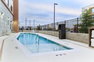 a swimming pool on the side of a building at Element Chattanooga East in Chattanooga