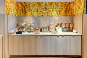 a counter with food items on top of it at Fairfield Inn & Suites by Marriott Cape Cod Hyannis in Hyannis