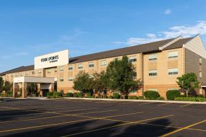 a parking lot in front of a hotel at Four Points by Sheraton Chicago Schaumburg in Schaumburg