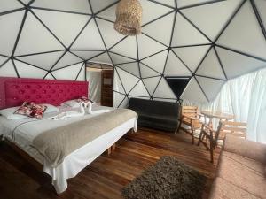 a bedroom with a large black and white wall at La Cabaña Glamping Geronimo in Playa Blanca