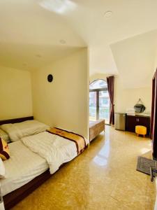 Postel nebo postele na pokoji v ubytování An Nhien Hotel