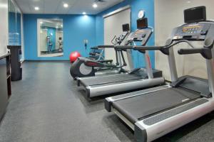 a gym with several tread machines in a room at Fairfield Inn & Suites Clarksville in Clarksville