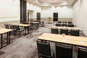 a large room with tables and chairs in it at Courtyard by Marriott Fort Worth Alliance Town Center in Fort Worth