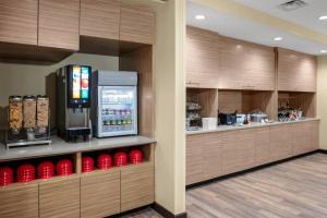 a coffee shop with a vending machine in a building at TownePlace Suites by Marriott Gainesville in Gainesville