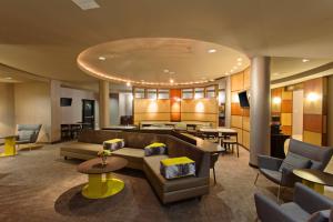 a lobby with couches and chairs and tables at SpringHill Suites by Marriott El Paso in El Paso
