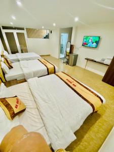 Postel nebo postele na pokoji v ubytování An Nhien Hotel