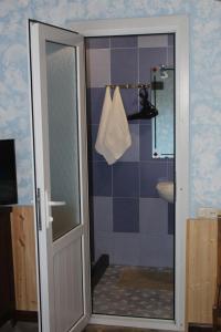 a bathroom with a shower with a glass door at Eco Garden Dilijan in Dilijan