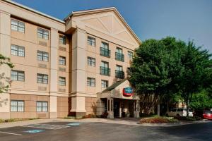 a large building with a parking lot in front of it at TownePlace Suites Atlanta Buckhead in Atlanta
