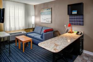 a hotel room with a couch and a living room at TownePlace Suites Atlanta Buckhead in Atlanta