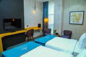 Postel nebo postele na pokoji v ubytování Iris Hotel Baku - Halal Hotel