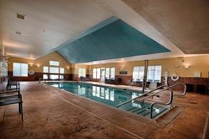 a large swimming pool in a large building at Residence Inn by Marriott Atlantic City Airport Egg Harbor Township in Egg Harbor Township