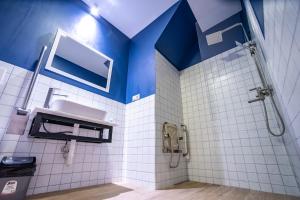 a bathroom with a shower and a sink at Tiflis Hotel in Tbilisi City +84 photos