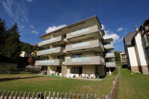 a building with a fence in front of it at Valbella in Davos