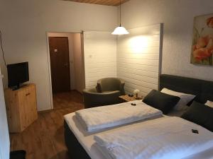 Postel nebo postele na pokoji v ubytování Hotel Schachten