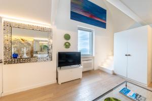TV a/nebo společenská místnost v ubytování Casa Boutique by Capri 5 Senses