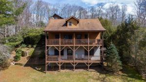 a large house with a porch and a balcony at Nuttin' Better in Blowing Rock