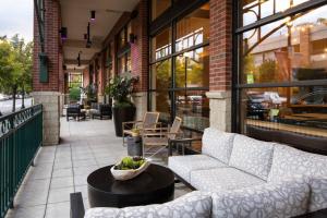 a patio with a couch and a table at Seattle Marriott Redmond in Redmond