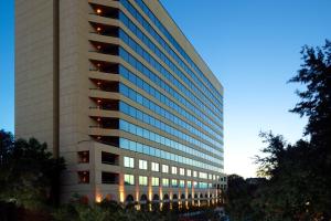 a tall building with a lot of windows at Austin Southpark Hotel in Austin