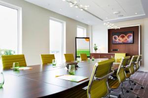 a conference room with a long table and chairs at Courtyard by Marriott Aberdeen Airport in Dyce