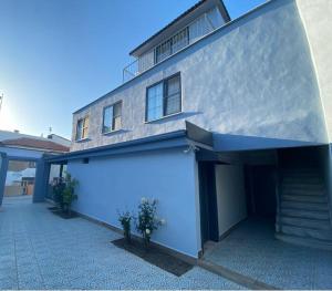 a large white building with a large garage at Vesta Butik Otel in Edremit +11 photos