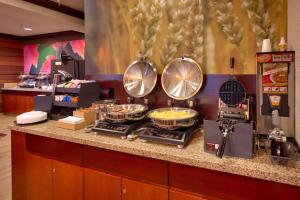 a buffet of food on a counter in a restaurant at Fairfield Inn & Suites by Marriott Yuma in Yuma