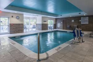 a large swimming pool in a hotel room at Fairfield Inn & Suites Savannah I-95 South in Savannah