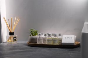 a tray with several bottles of essential oils on a table at Board apart hotel in Odesa