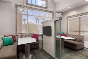 a waiting room with couches and a tv at Residence Inn By Marriott Las Vegas Stadium Area in Las Vegas