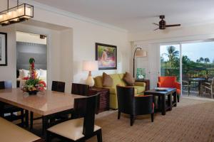a living room with a couch and a table at Marriott's Waiohai Beach Club in Koloa