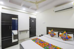 a bedroom with two beds in a room at FabHotel Villa 31 in Nagpur