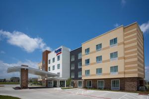 a hotel building with a sign in front of it at Fairfield Inn & Suites by Marriott Dallas West/I-30 in Dallas
