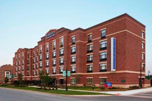 a red brick building on the corner of a street at Fairfield Inn & Suites South Bend at Notre Dame in South Bend