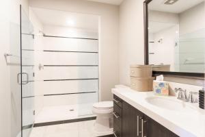 a bathroom with a toilet and a sink and a shower at NEW! PGA West (Signature!) walk to Stadium Course! in La Quinta +19 photos