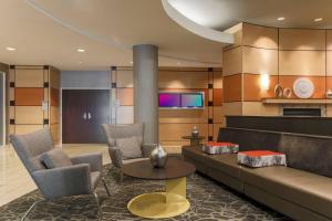 a living room with a couch and chairs and a tv at SpringHill Suites by Marriott Yuma in Yuma