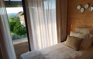 Cama ou camas em um quarto em Devagar & Devagarinho
