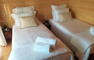 Cama ou camas em um quarto em Devagar & Devagarinho