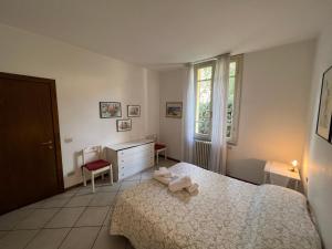 A bed or beds in a room at Casa Viale Amico - Giardino Privato